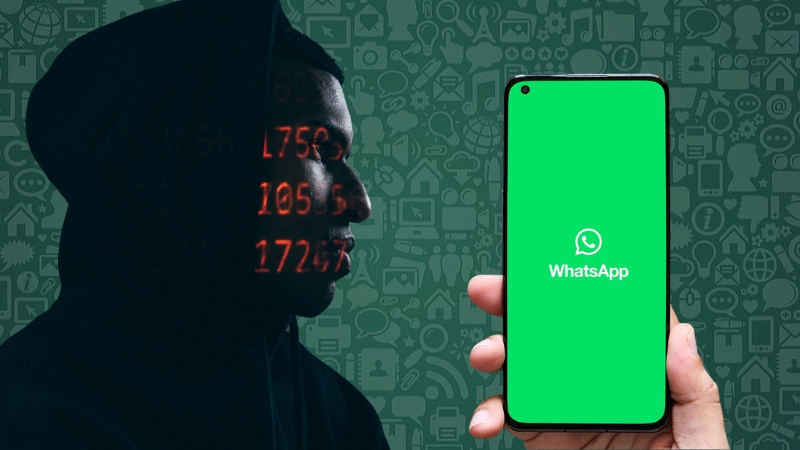 Person in shadow facing a phone with WhatsApp open