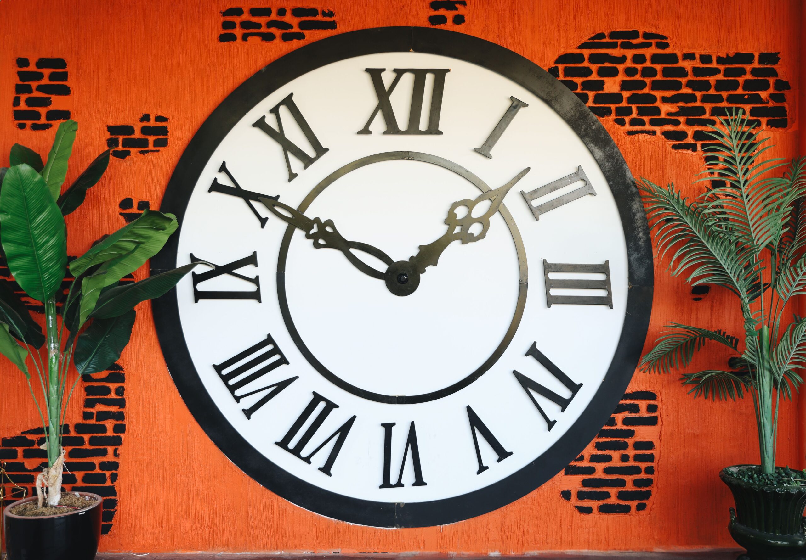 Vintage wall clock with Roman numerals symbolizing the first seconds ticking away