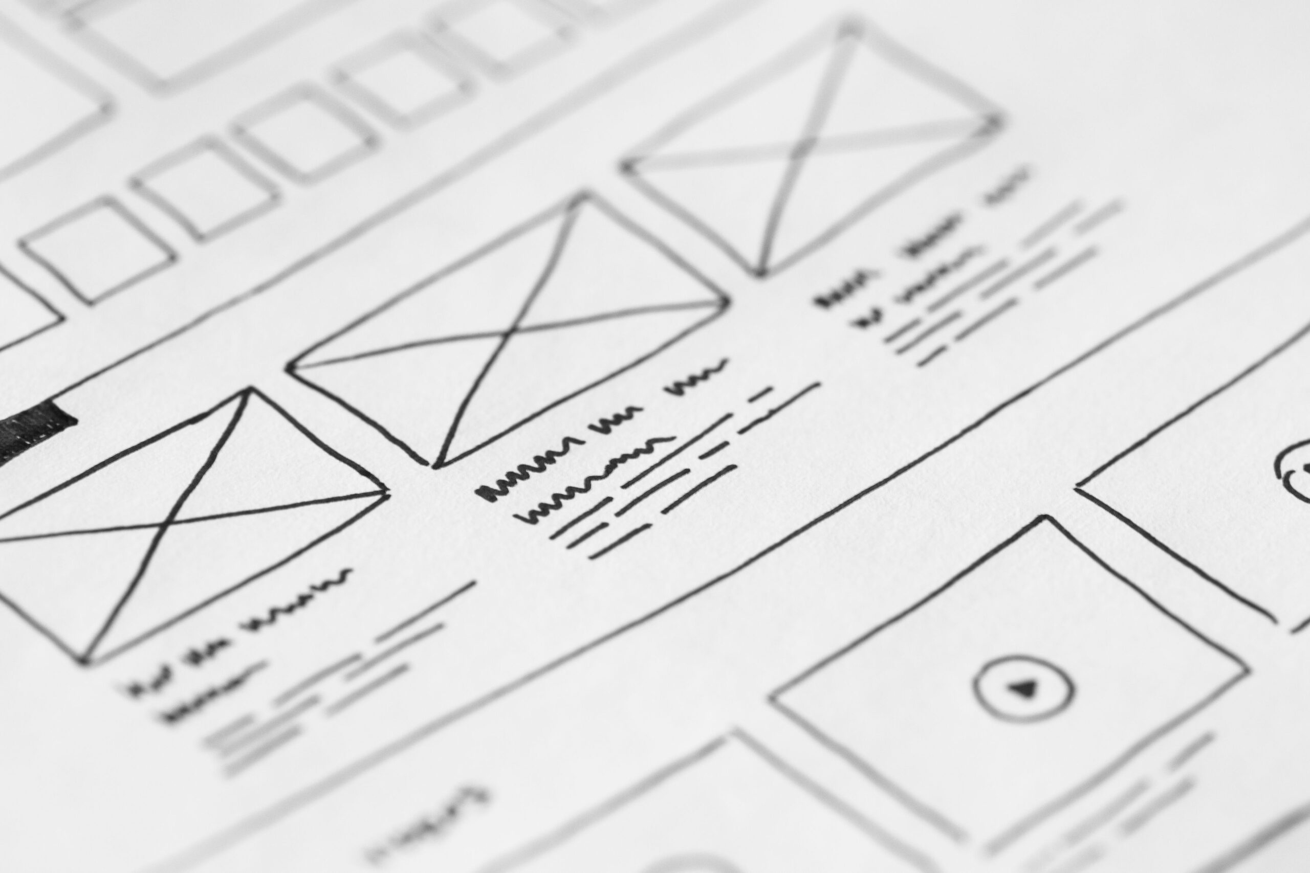 Hand-drawn UX wireframe sketch representing website layout planning