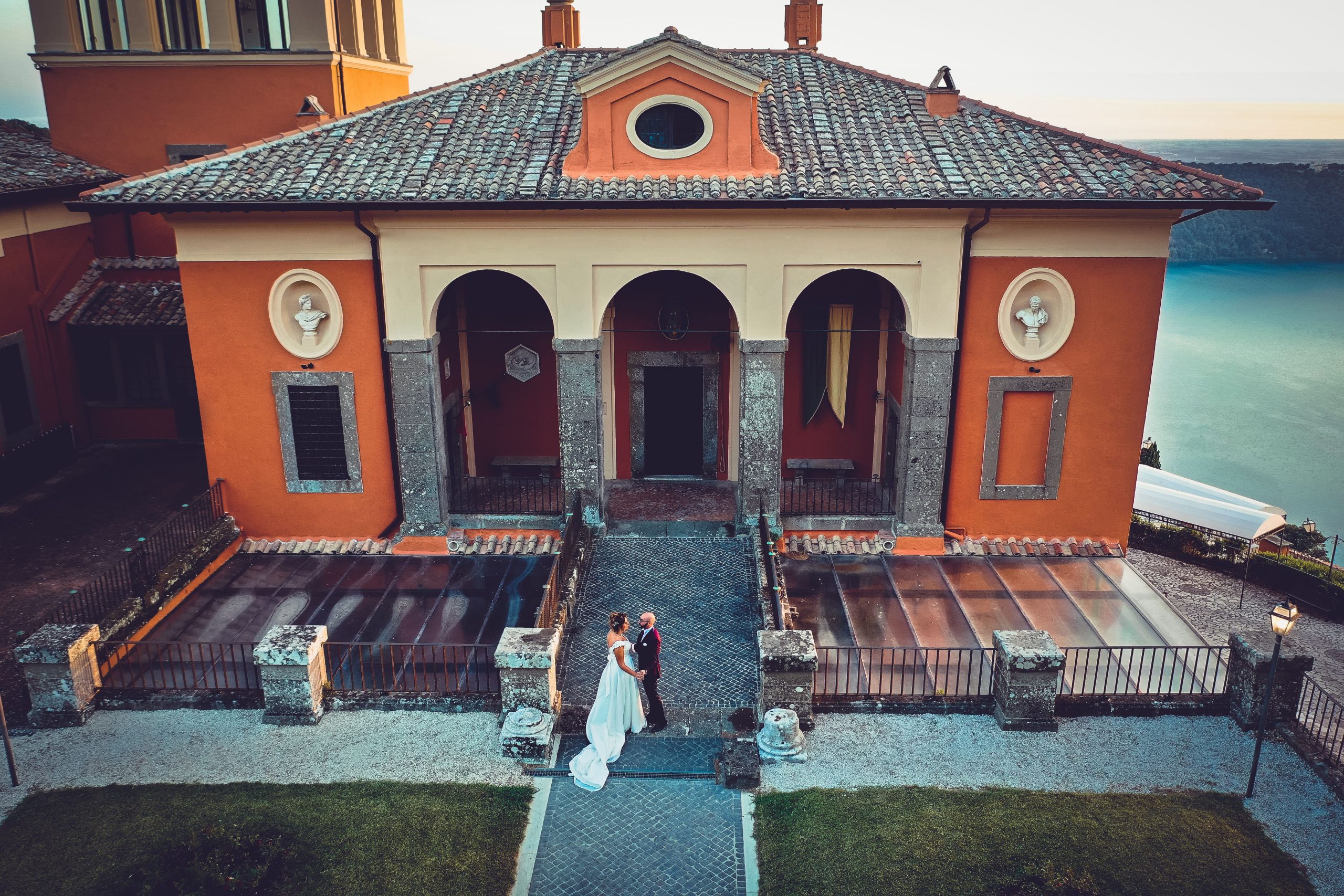 Aerial view of a bride and groom at a historical Italian villa, symbolizing the elegance of an Italy destination wedding