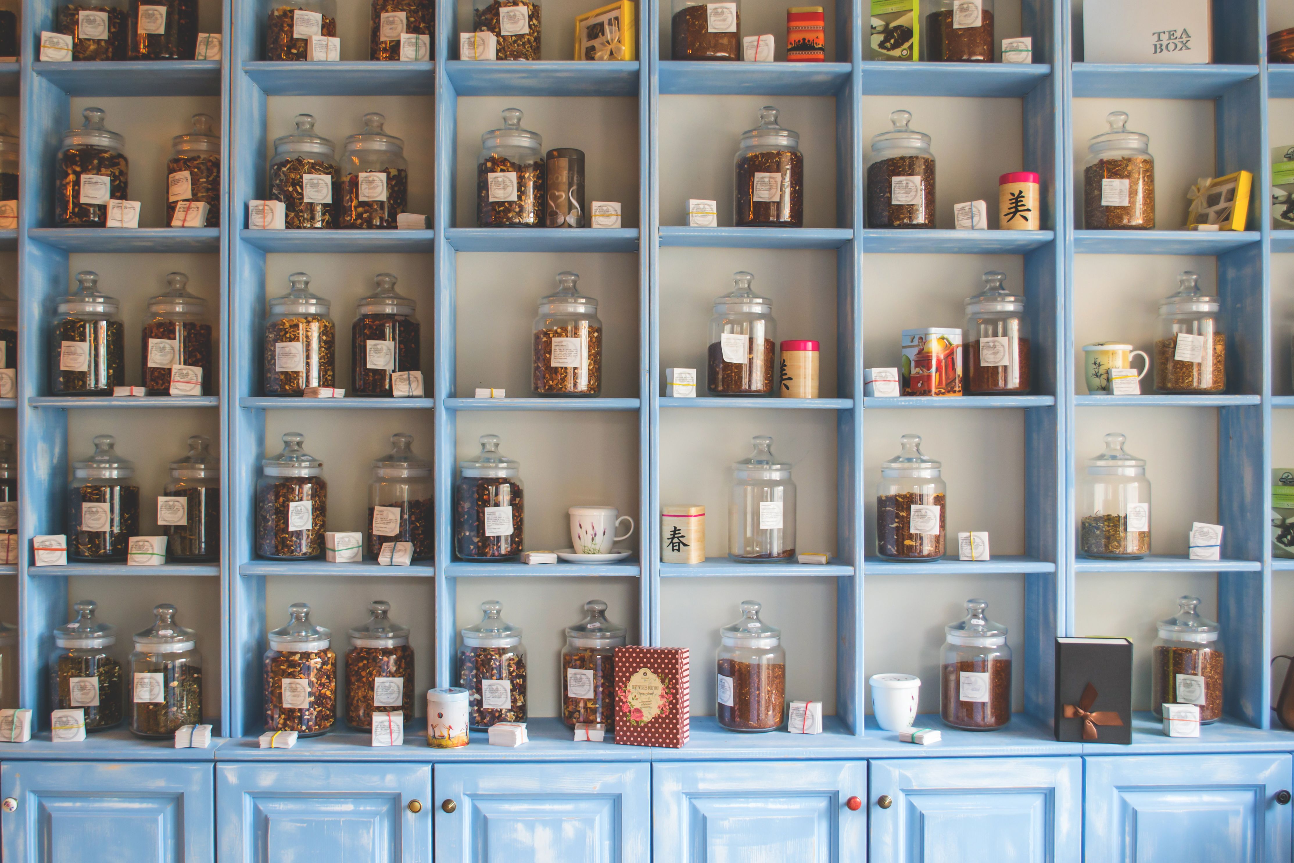 Organized product display jars arranged on vibrant boutique shelves