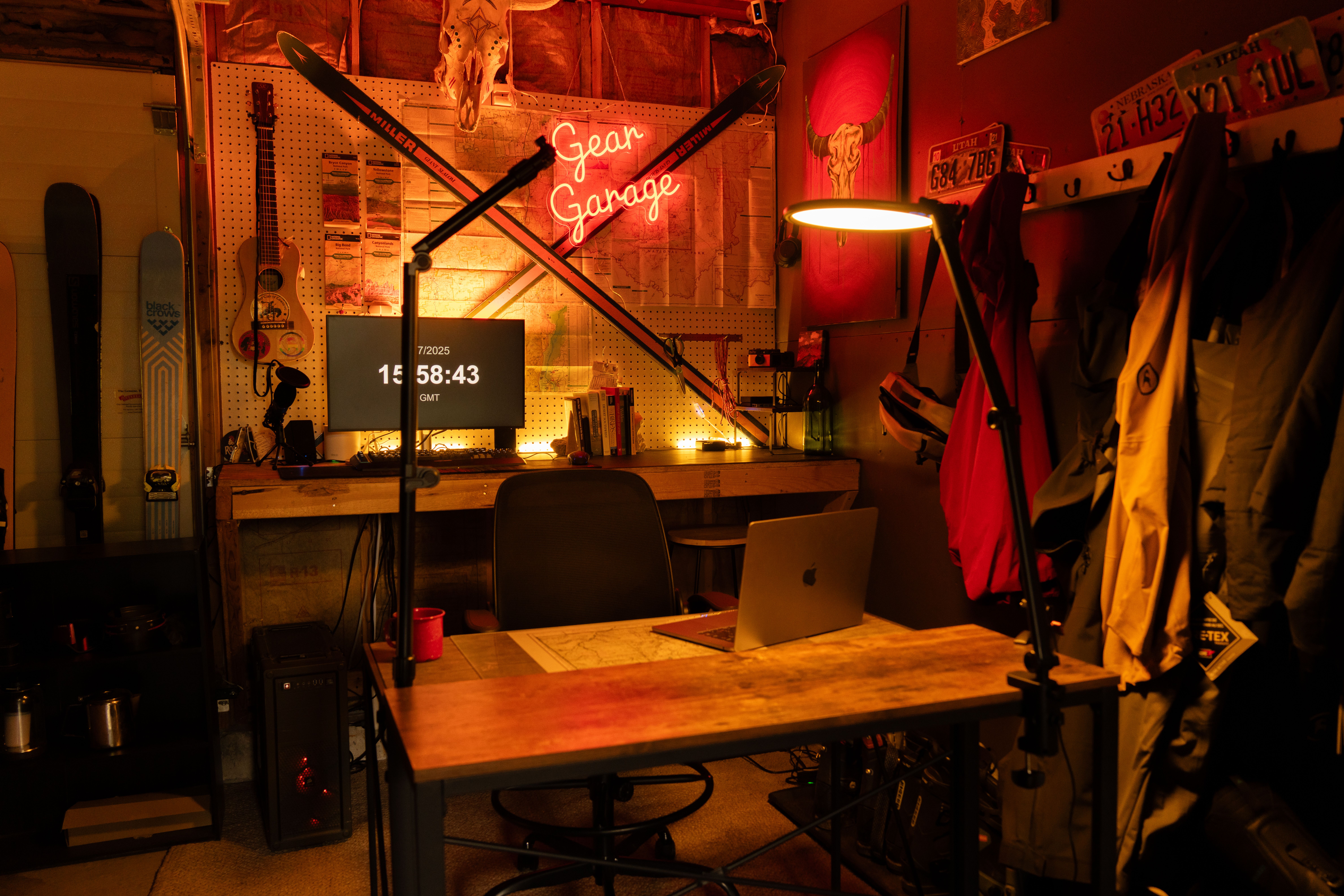 Cozy home workspace set up inside a converted garage with ambient lighting