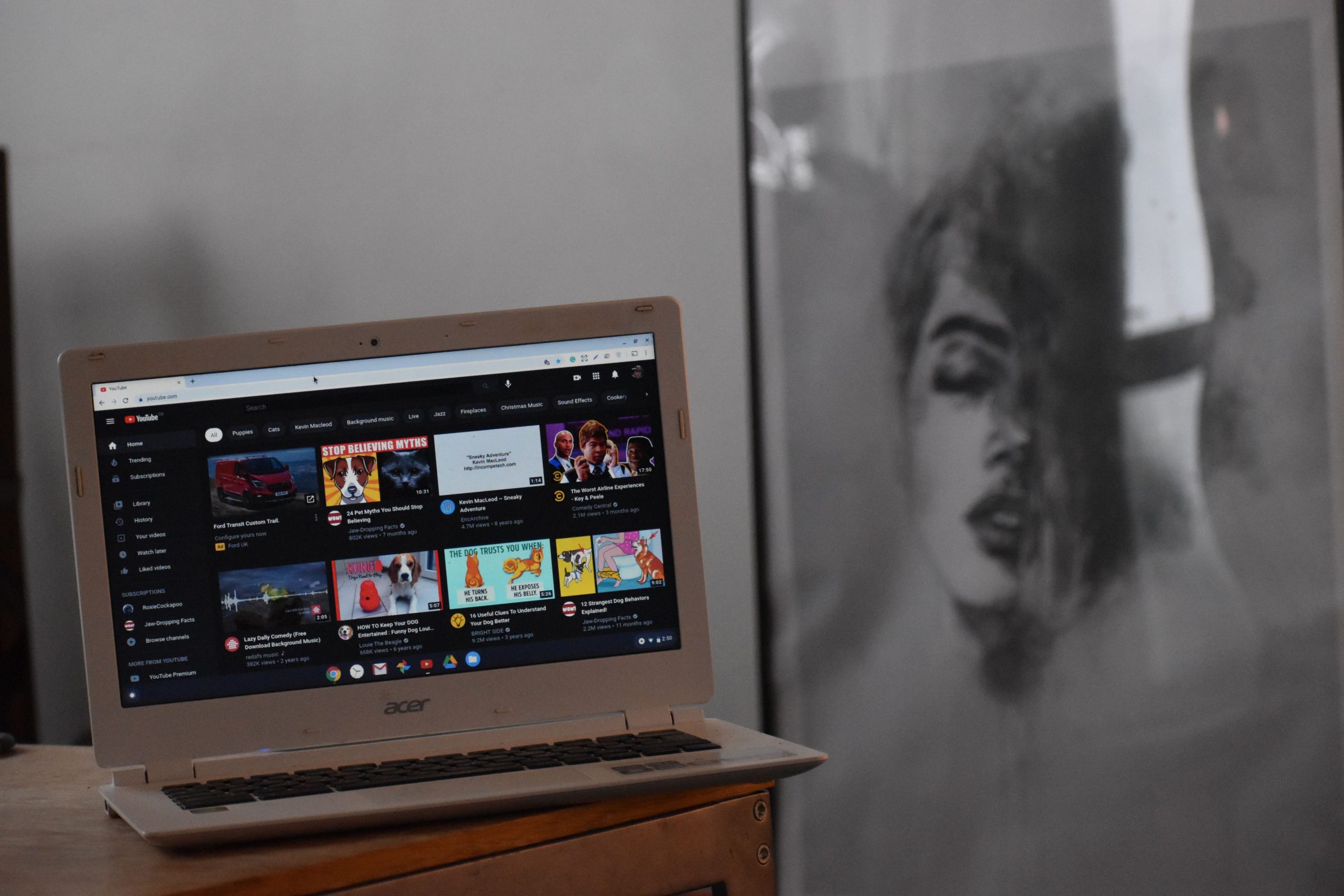 Laptop displaying YouTube in a creator's workspace, illustrating channel discovery and audience growth.